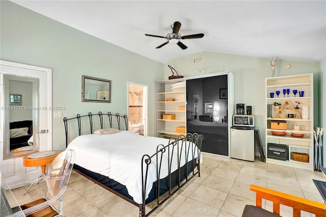 5700 NE 5th Ave, Miami, FL 33137 - bedroom with lofted ceiling, fridge, ceiling fan, connected bathroom, and light tile patterned floors