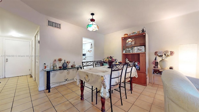 13715 Kendale Lakes Cir Unit Ph-A10, Miami, FL 33183 - dining space featuring light tile patterned flooring and visible vents
