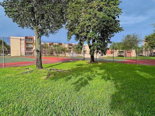 13715 Kendale Lakes Cir Unit Ph-A10, Miami, FL 33183 - view of community featuring fence, a yard, and a tennis court