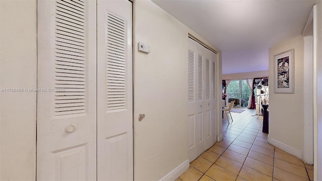 13715 Kendale Lakes Cir Unit Ph-A10, Miami, FL 33183 - corridor featuring baseboards and light tile patterned flooring