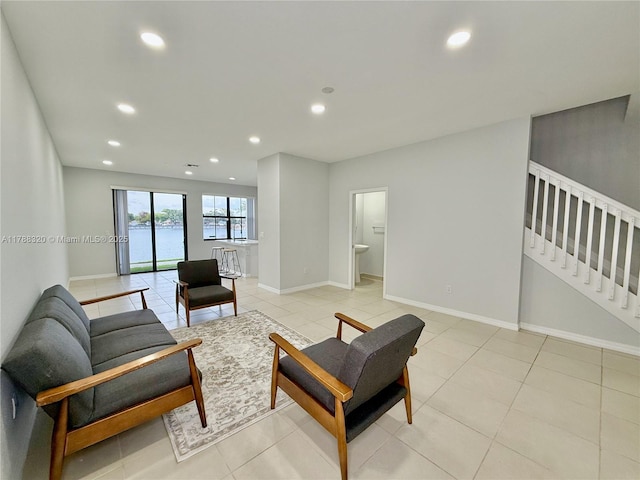 1047 NW 33rd Mnr, Pompano Beach, FL 33064 - living area featuring recessed lighting, baseboards, light tile patterned floors, and stairway
