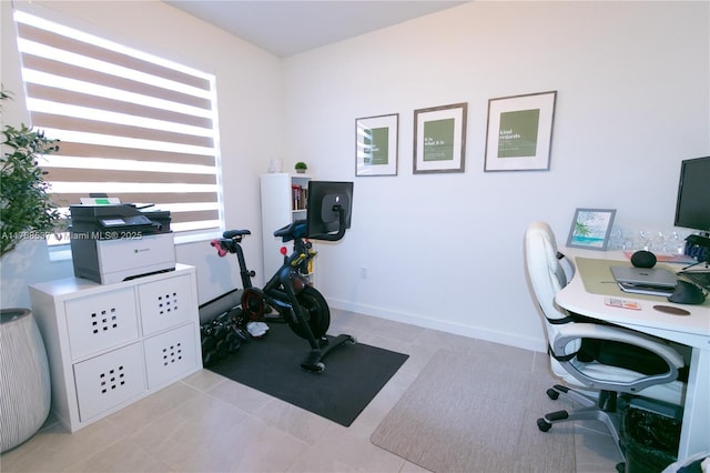 office with baseboards and light tile patterned flooring