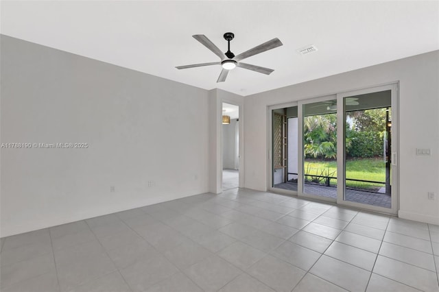unfurnished room featuring ceiling fan and tile patterned flooring