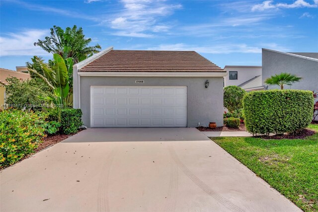 17068 Traverse Cir, Jupiter, FL 33477 - garage with driveway