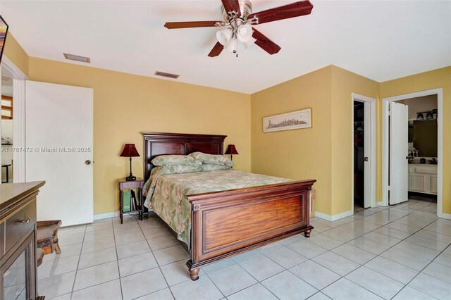 17068 Traverse Cir, Jupiter, FL 33477 - bedroom with light tile patterned floors, baseboards, and ceiling fan