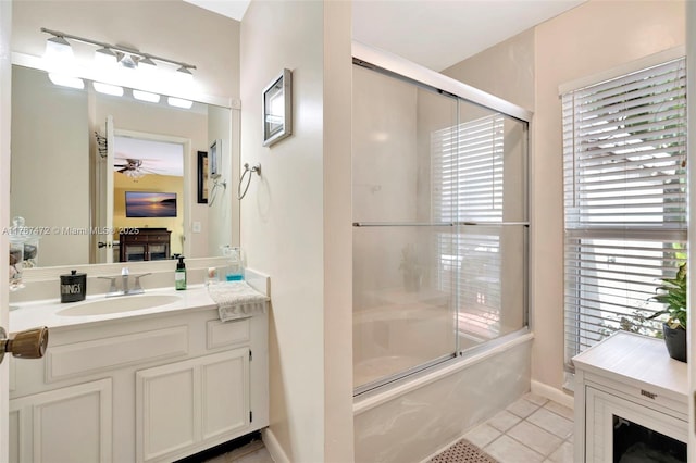 17068 Traverse Cir, Jupiter, FL 33477 - full bathroom featuring ceiling fan, tile patterned flooring, enclosed tub / shower combo, vanity, and healthy amount of natural light