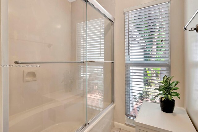 17068 Traverse Cir, Jupiter, FL 33477 - full bathroom with a shower with door, a tub to relax in, and baseboards