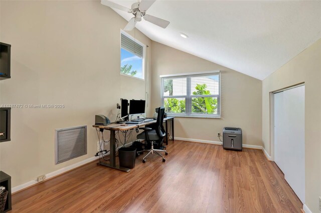 17068 Traverse Cir, Jupiter, FL 33477 - home office with lofted ceiling, wood finished floors, ceiling fan, and baseboards