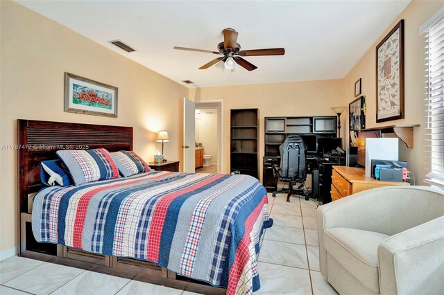 17068 Traverse Cir, Jupiter, FL 33477 - bedroom featuring a desk, a ceiling fan, light tile patterned flooring, and connected bathroom