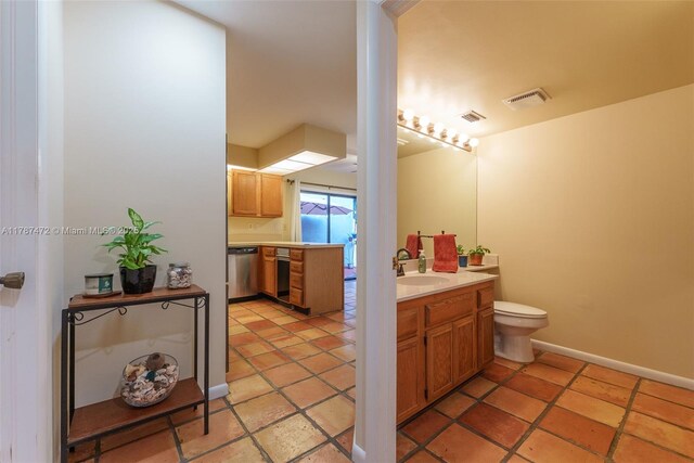17068 Traverse Cir, Jupiter, FL 33477 - bathroom with vanity, toilet, and baseboards