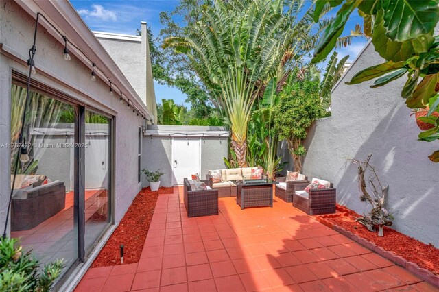 17068 Traverse Cir, Jupiter, FL 33477 - view of patio featuring an outdoor hangout area
