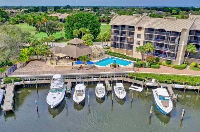 17068 Traverse Cir, Jupiter, FL 33477 - bird's eye view of a pool area, a large body of water, and a tree filled landscape
