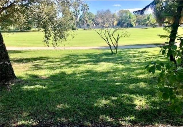 view of home's community with a lawn