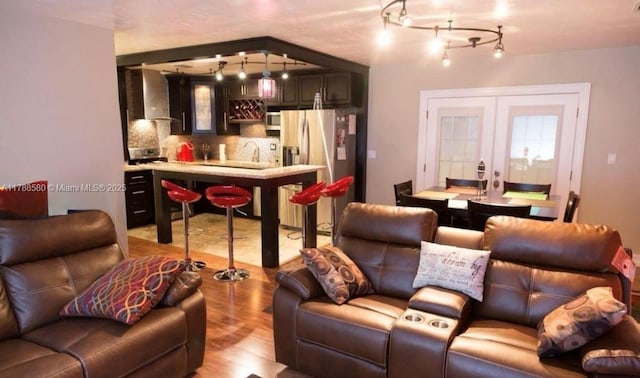 6472 Johnson St, Hollywood, FL 33024 - living room with wet bar and light wood-style floors