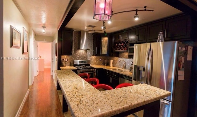 6472 Johnson St, Hollywood, FL 33024 - kitchen with a sink, light stone countertops, wall chimney exhaust hood, tasteful backsplash, and appliances with stainless steel finishes