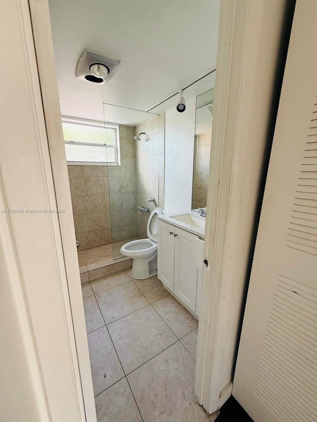 6191 SW 37th St Unit 106, Davie, FL 33314 - bathroom with tile patterned flooring, a tile shower, toilet, and vanity