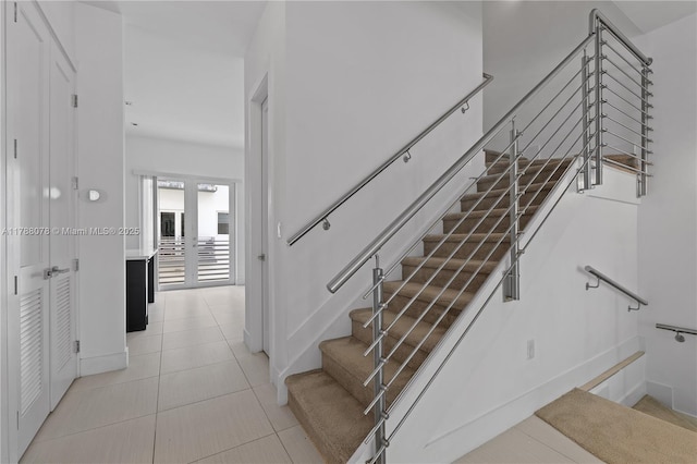 stairs with tile patterned floors