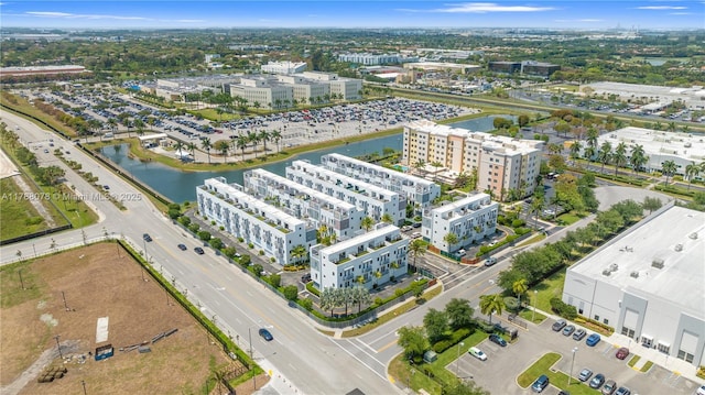 bird's eye view featuring a water view and a view of city