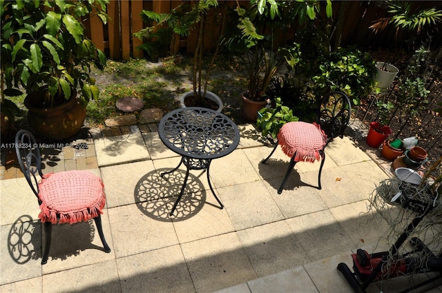 view of patio featuring fence