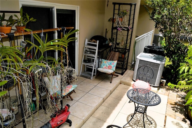view of patio featuring cooling unit and ac unit