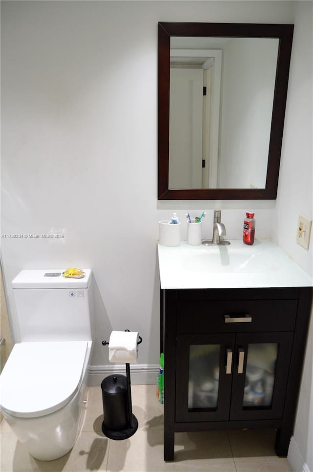 bathroom with toilet and vanity