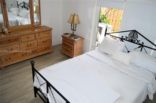 bedroom featuring wood finished floors