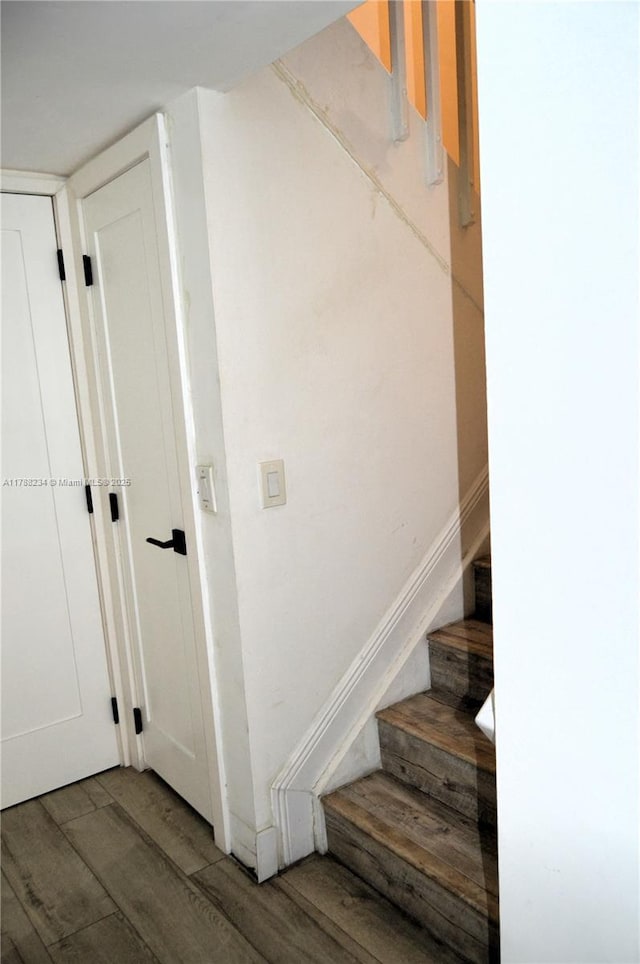 staircase with wood finished floors