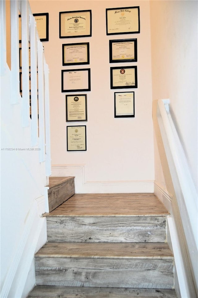 stairs with wood finished floors