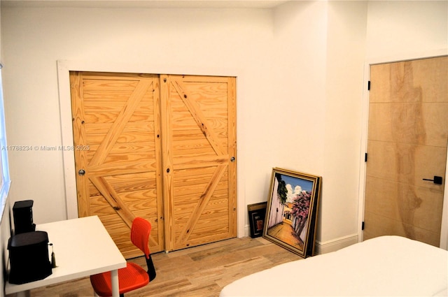 bedroom with wood finished floors