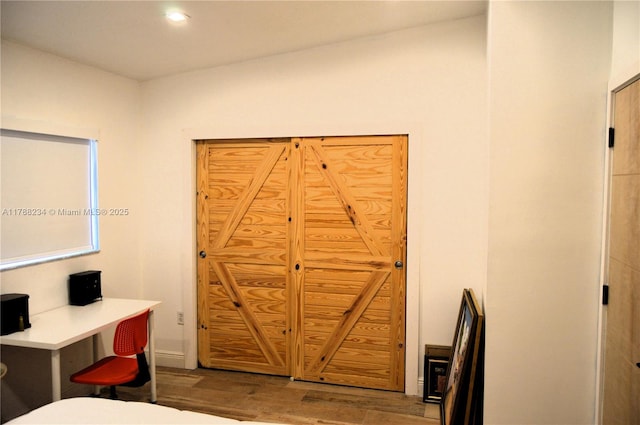 bedroom featuring recessed lighting, wood finished floors, and baseboards