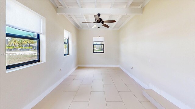 1550 NE 11th St, Homestead, FL 33033 - spare room with ceiling fan, beamed ceiling, baseboards, and light tile patterned flooring