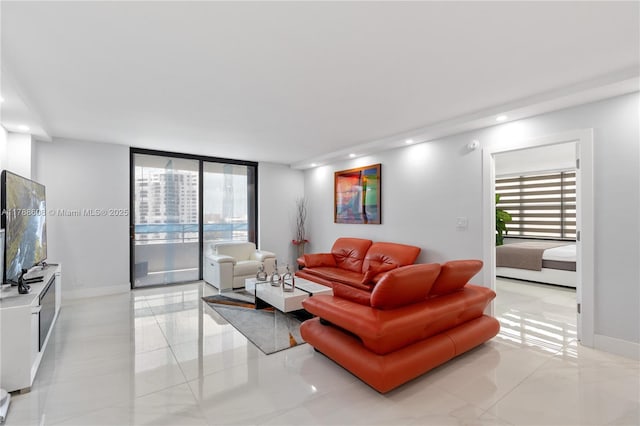 2500 Parkview Dr Unit 1121, Hallandale Beach, FL 33009 - living room featuring light tile patterned floors, baseboards, and recessed lighting