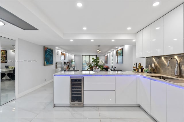 2500 Parkview Dr Unit 1121, Hallandale Beach, FL 33009 - kitchen with recessed lighting, white cabinets, beverage cooler, a sink, and modern cabinets