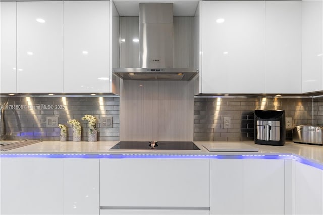 2500 Parkview Dr Unit 1121, Hallandale Beach, FL 33009 - kitchen with modern cabinets, range hood, and white cabinetry