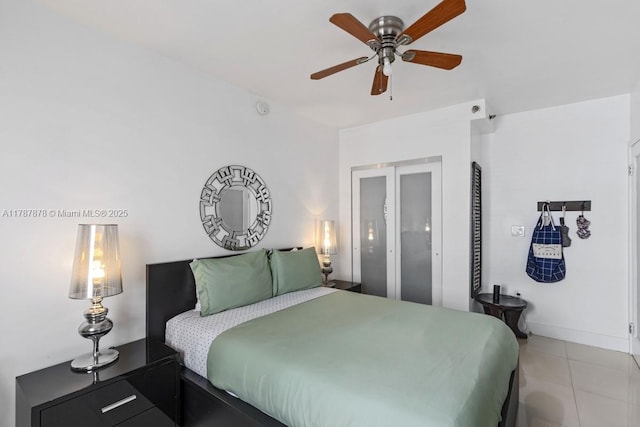335 Ocean Dr Unit 310, Miami Beach, FL 33139 - bedroom with a ceiling fan, baseboards, and light tile patterned flooring