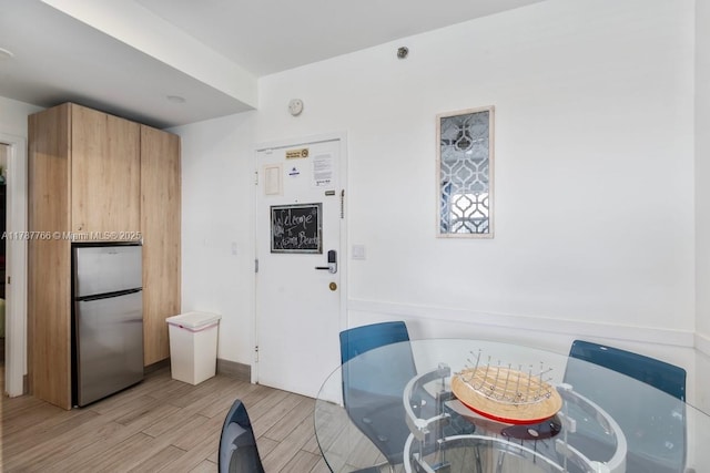 335 Ocean Dr Unit 122, Miami Beach, FL 33139 - dining space with light wood-style flooring