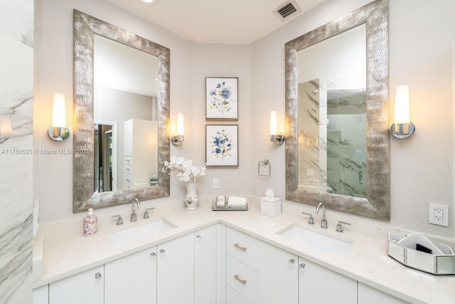 5134 W Madison Lakes Cir W, Davie, FL 33328 - bathroom featuring double vanity, visible vents, a marble finish shower, and a sink