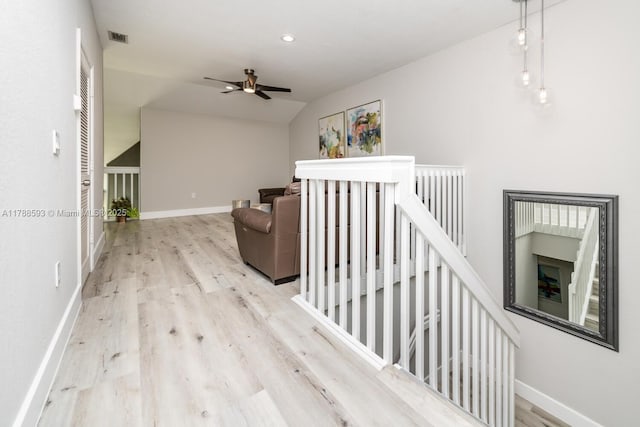 5134 W Madison Lakes Cir W, Davie, FL 33328 - hallway with wood finished floors, an upstairs landing, baseboards, visible vents, and lofted ceiling