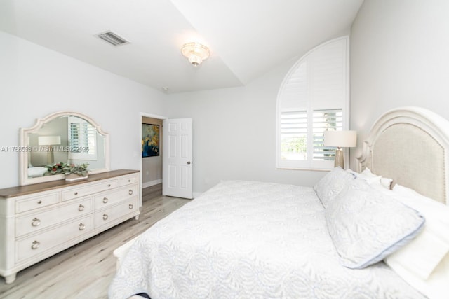 5134 W Madison Lakes Cir W, Davie, FL 33328 - bedroom featuring visible vents, light wood finished floors, and vaulted ceiling