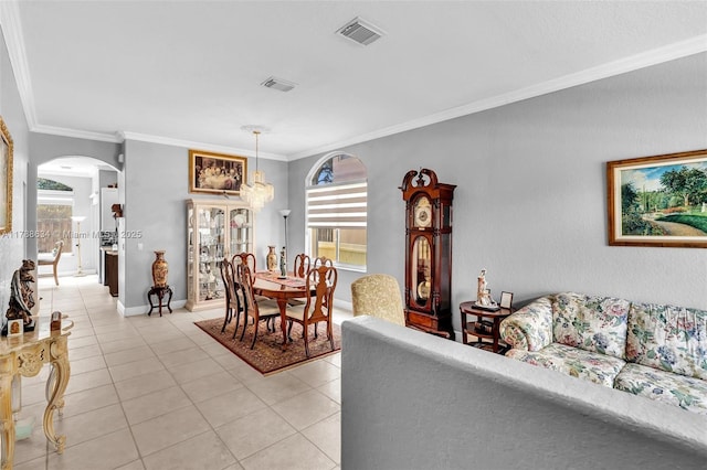 7738 NW 17th Pl, Pembroke Pines, FL 33024 - living area featuring arched walkways, crown molding, light tile patterned floors, and baseboards