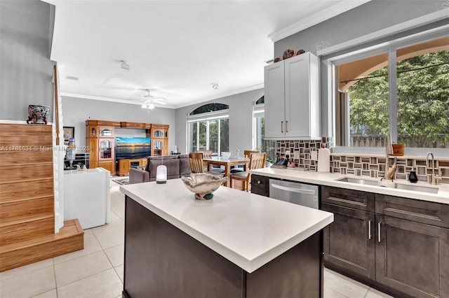 7738 NW 17th Pl, Pembroke Pines, FL 33024 - kitchen featuring stainless steel dishwasher, light tile patterned flooring, ceiling fan, ornamental molding, and light countertops