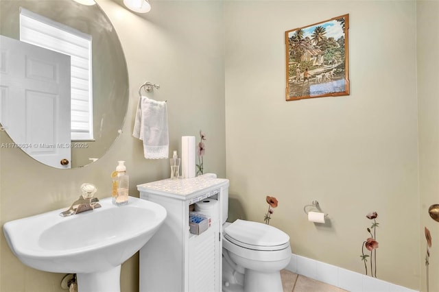 7738 NW 17th Pl, Pembroke Pines, FL 33024 - half bathroom featuring toilet, a sink, tile patterned flooring, and baseboards