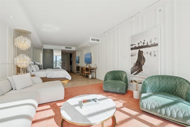 living room featuring visible vents and wood finished floors