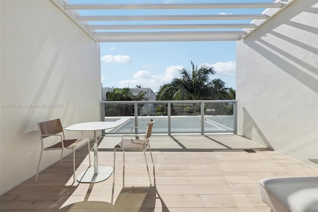 balcony featuring a pergola