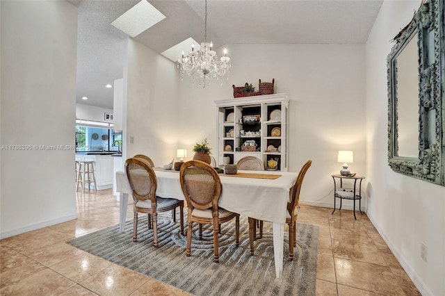 dining room featuring baseboards, an inviting chandelier, and light tile patterned flooring