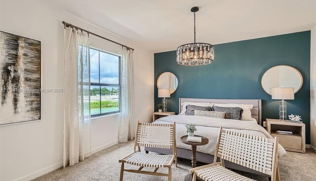 1454 NE 3rd Ave, Florida City, FL 33034 - carpeted bedroom with baseboards and a notable chandelier