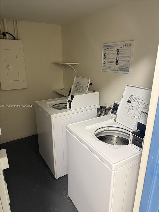 common laundry area featuring electric panel and washer and dryer