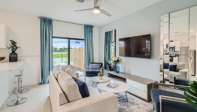 1472 NE 3rd Ave, Florida City, FL 33034 - living room with visible vents, ceiling fan, and light tile patterned floors