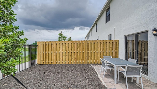 1472 NE 3rd Ave, Florida City, FL 33034 - view of patio / terrace featuring a fenced backyard and outdoor dining area