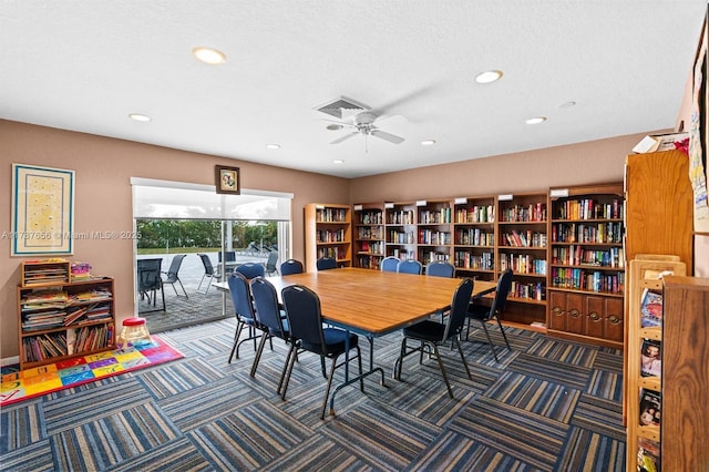 carpeted dining room featuring visible vents, a ceiling fan, and recessed lighting